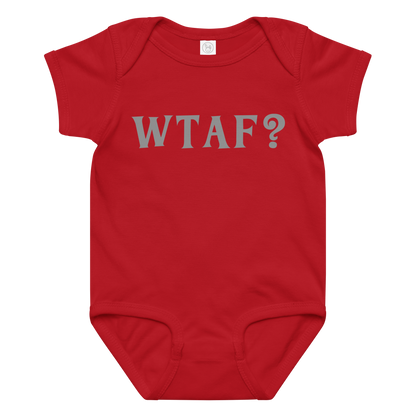 "WTAF?" printed on a red baby jersey bodysuit laying on a flat surface amongst other clothes