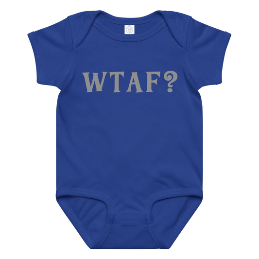 "WTAF?" printed on a royal baby jersey bodysuit laying on a flat surface amongst other clothes