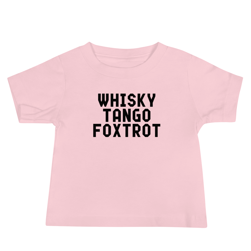 "Whisky Tango Foxtrot (What the f#ck)" printed on a pink baby jersey short sleeve tee laying on a flat surface