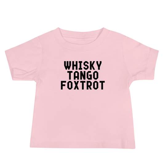 "Whisky Tango Foxtrot (What the f#ck)" printed on a pink baby jersey short sleeve tee laying on a flat surface