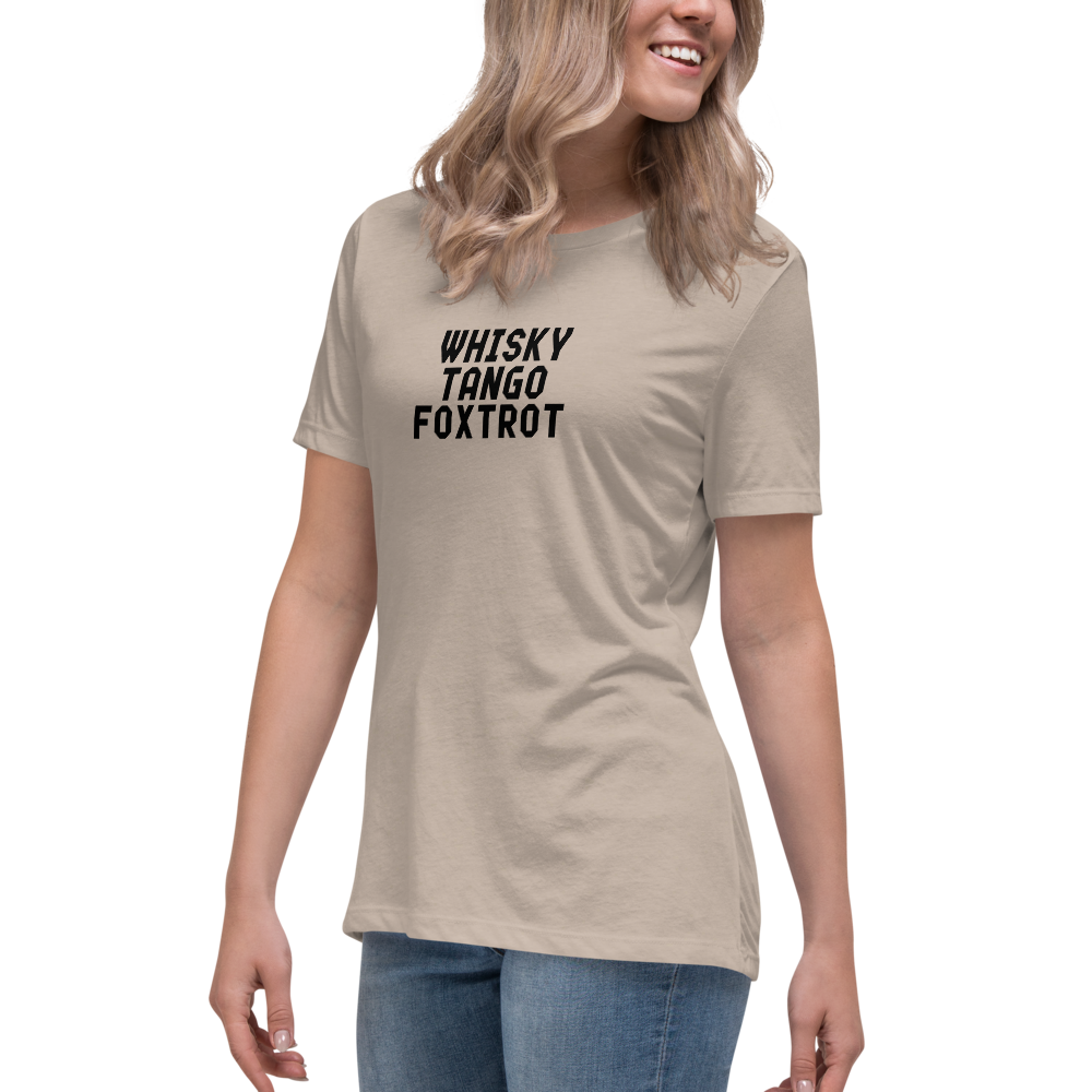 "Whisky Tango Foxtrot (What the f#ck)" printed on a heather stone women's relaxed t-shirt worn by a female