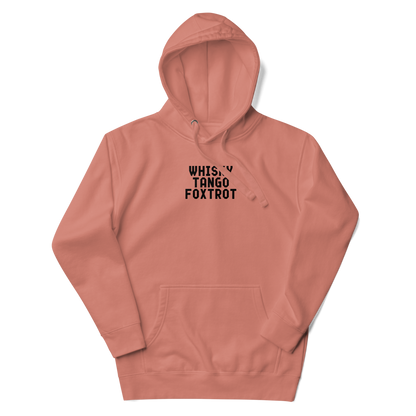 "Whisky Tango Foxtrot (What the f#ck)" printed on a dusty rose unisex hoodie laying on a flat surface with the hood up