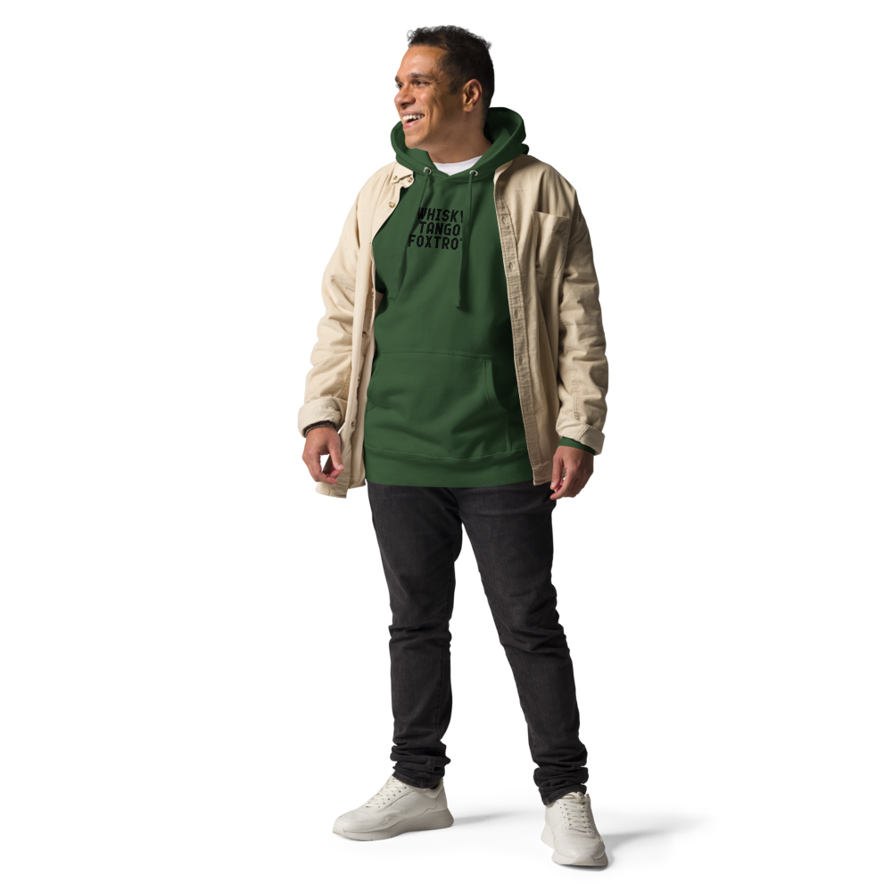 "Whisky Tango Foxtrot (What the f#ck)" printed on a forest green unisex hoodie worn by a male with a jacket on top