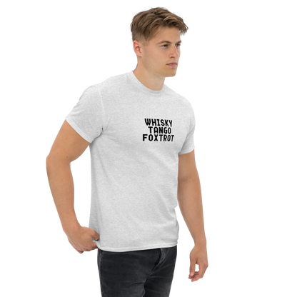 "Whisky Tango Foxtrot (What the f#ck)" printed on a ash unisex classic tee worn by a male