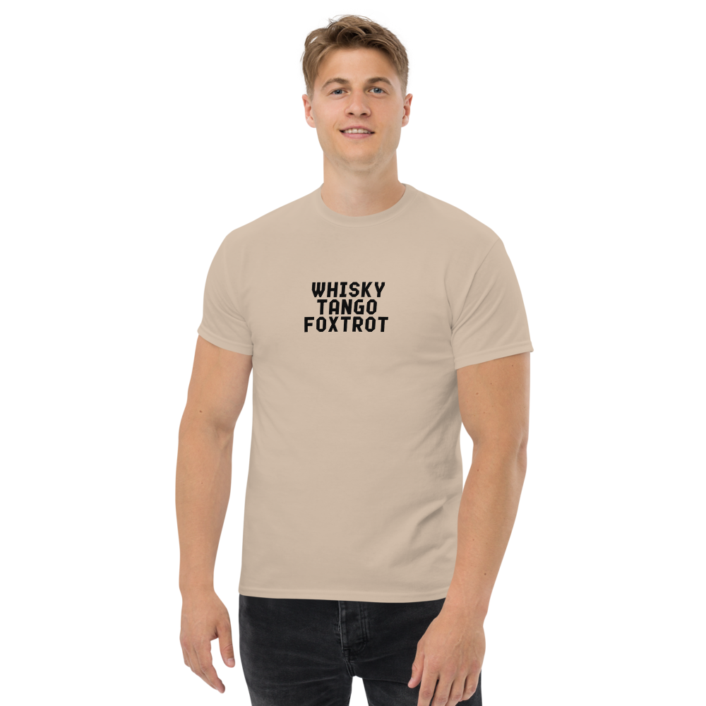 "Whisky Tango Foxtrot (What the f#ck)" printed on a sand unisex classic tee worn by a male