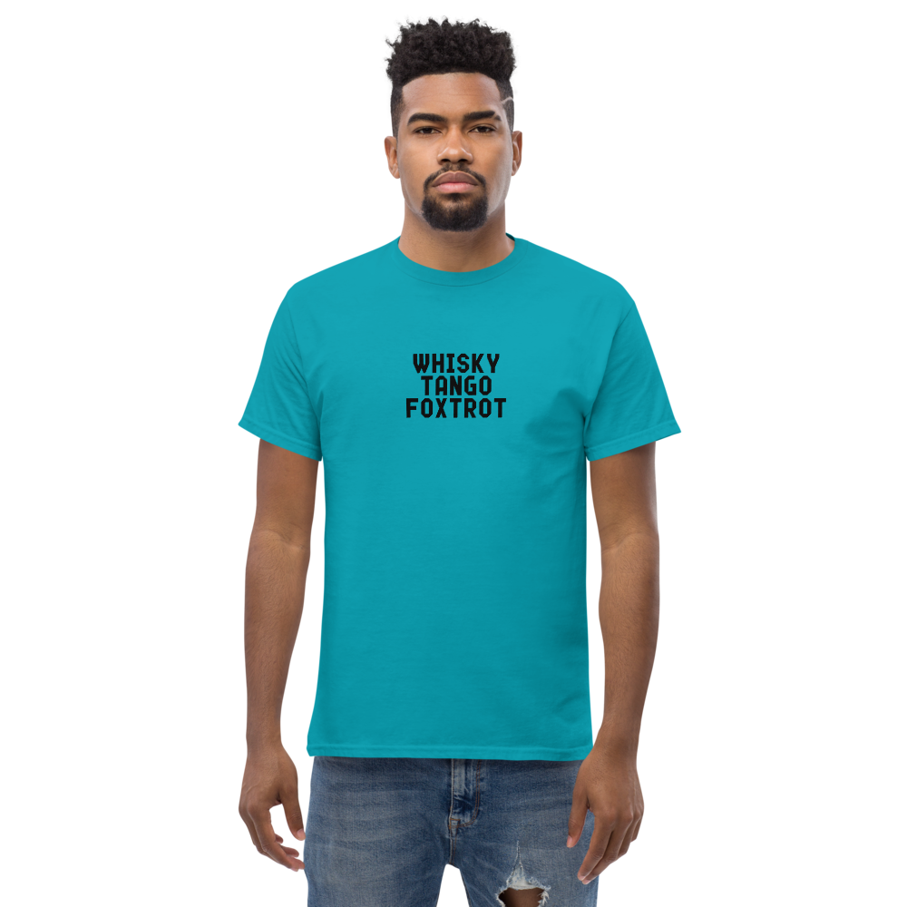 "Whisky Tango Foxtrot (What the f#ck)" printed on a tropical blue unisex classic tee worn by a male
