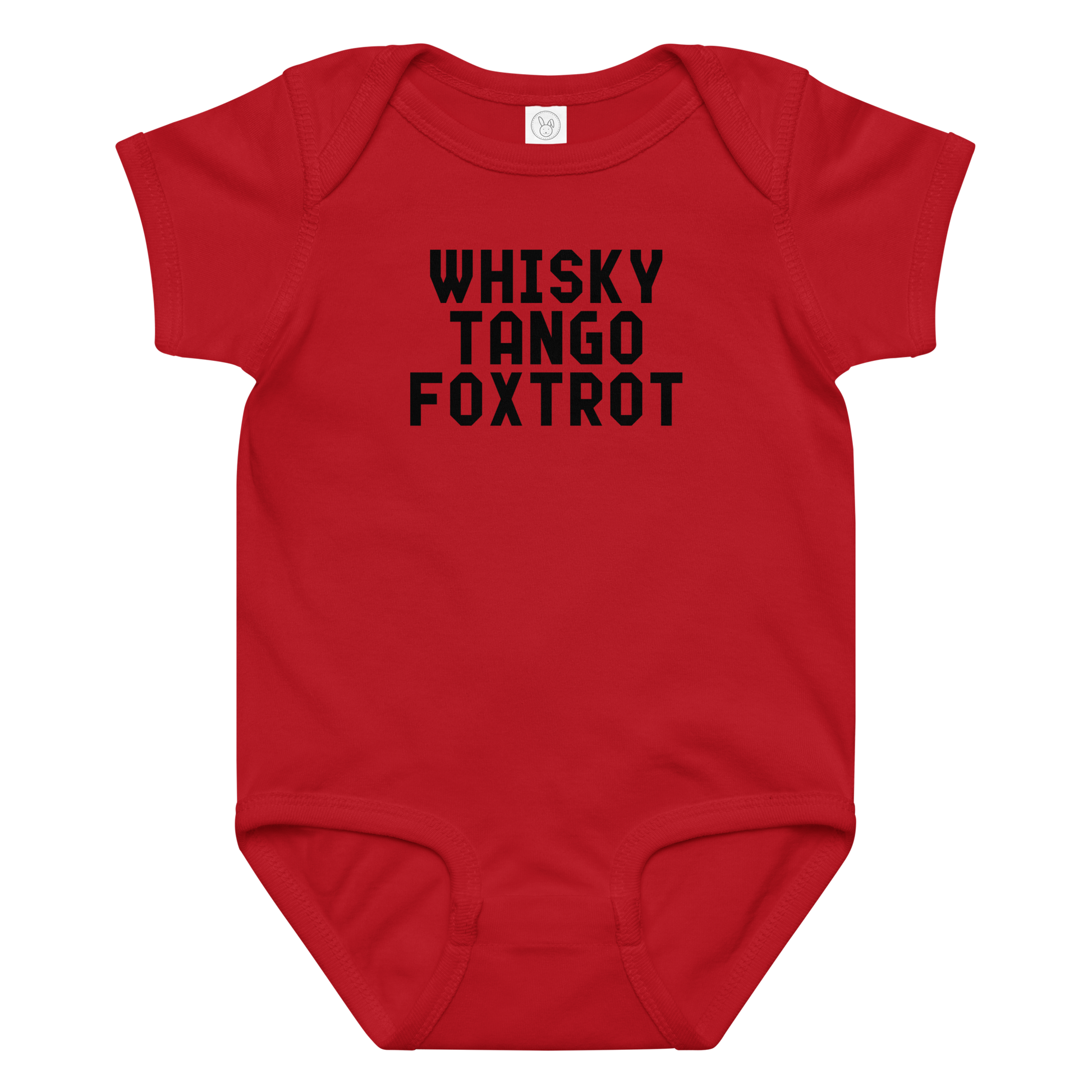 "Whisky Tango Foxtrot (What the f#ck)" printed on a red baby jersey bodysuit laying on a flat surface amongst other clothes