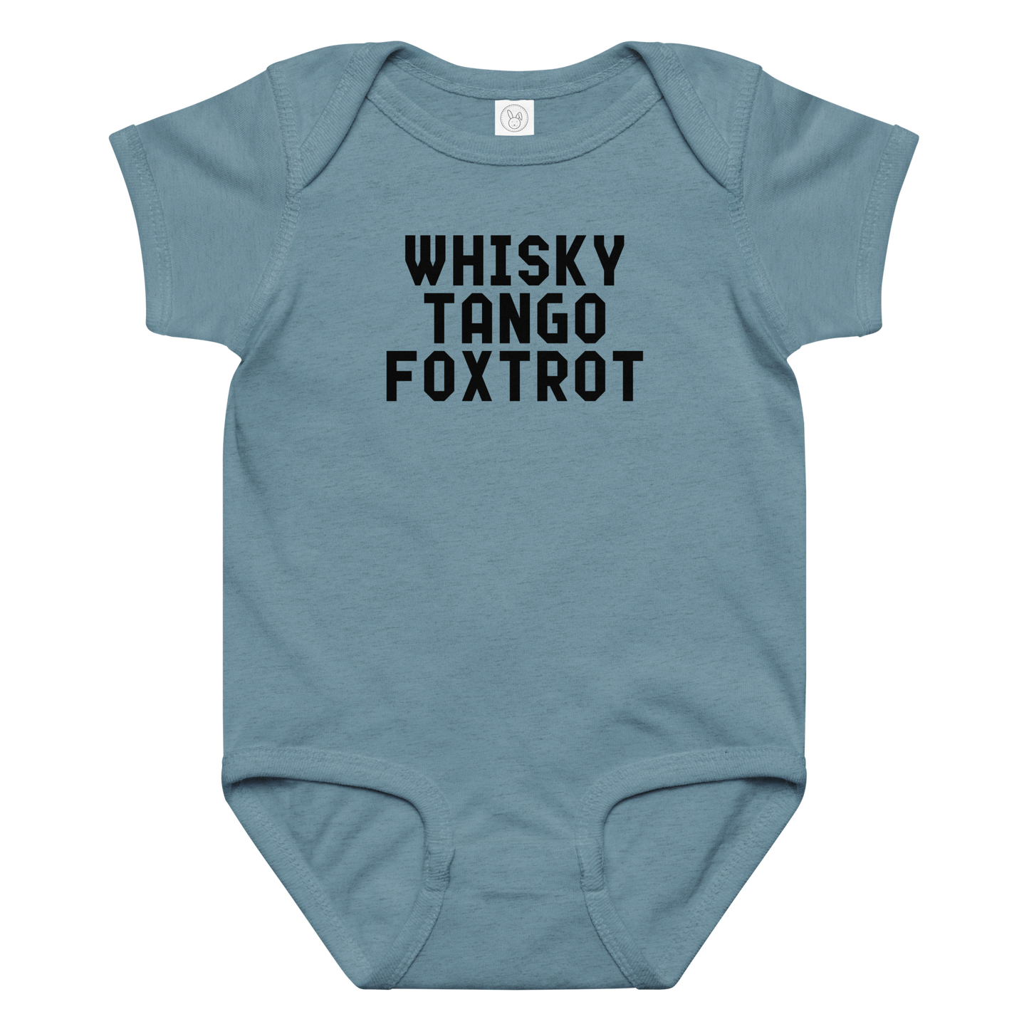 "Whisky Tango Foxtrot (What the f#ck)" printed on a vintage indigo baby jersey bodysuit laying on a flat surface amongst other clothes