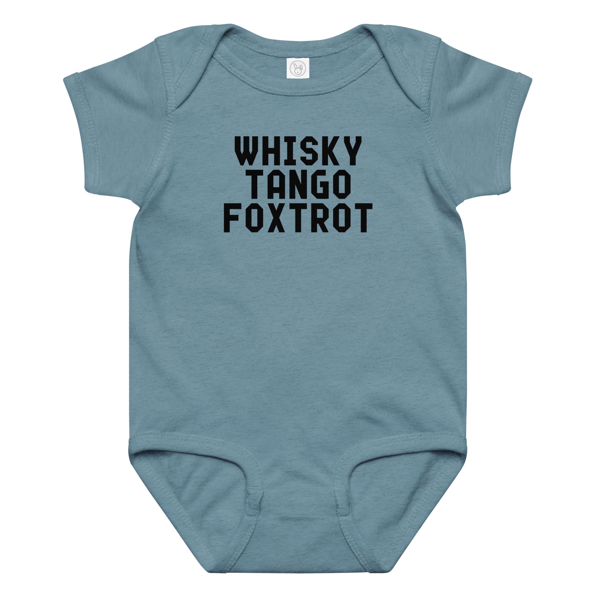 "Whisky Tango Foxtrot (What the f#ck)" printed on a vintage indigo baby jersey bodysuit laying on a flat surface amongst other clothes