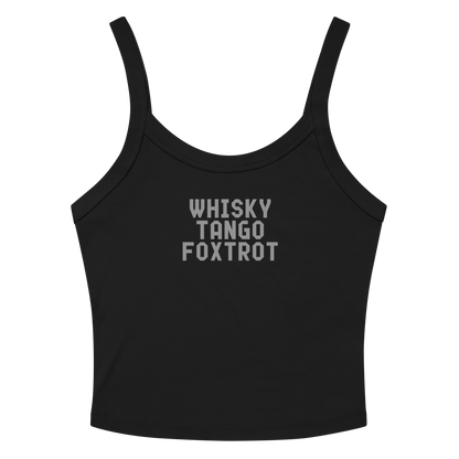 "Whisky Tango Foxtrot (What the f#ck)" printed on a solid black blend women's micro-rib tanktop laying on a flat surface amongst sunglasses and shorts