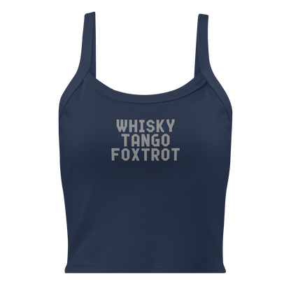 "Whisky Tango Foxtrot (What the f#ck)" printed on a solid navy blend women's micro-rib tanktop laying on a flat surface