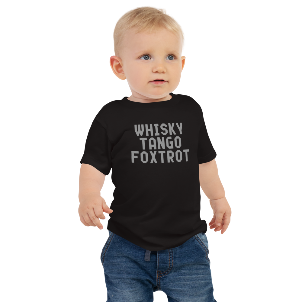"Whisky Tango Foxtrot (What the f#ck)" printed on a black baby jersey short sleeve tee worn by a male