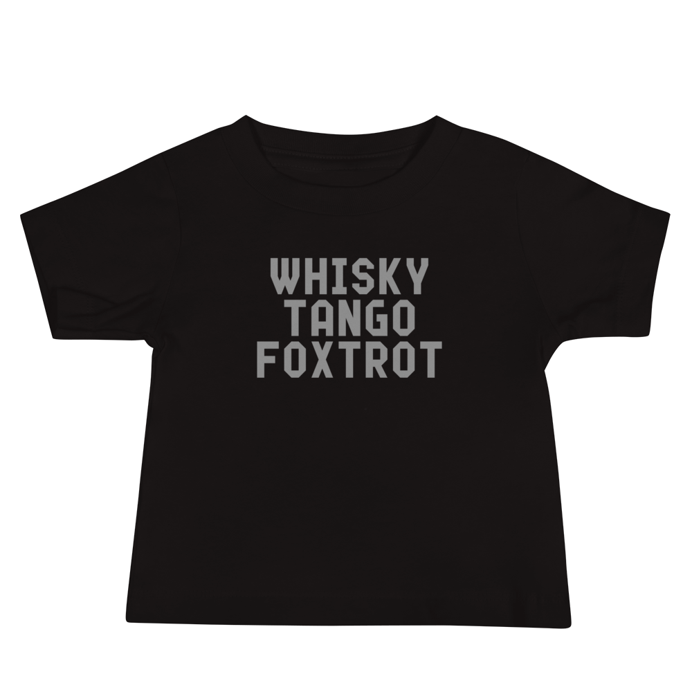 "Whisky Tango Foxtrot (What the f#ck)" printed on a black baby jersey short sleeve tee laying on a flat surface