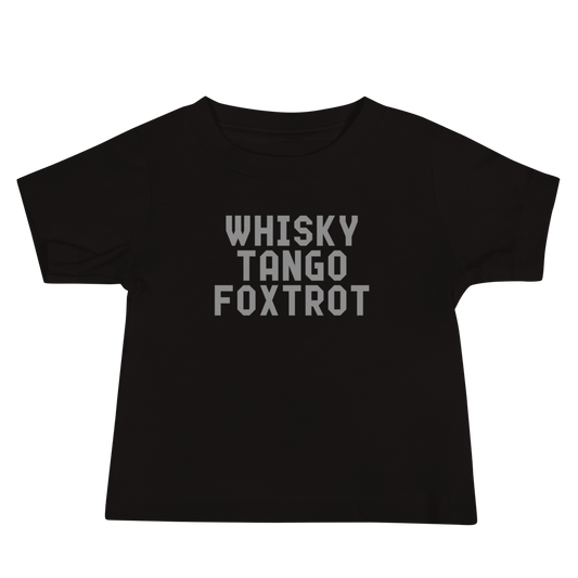 "Whisky Tango Foxtrot (What the f#ck)" printed on a black baby jersey short sleeve tee laying on a flat surface