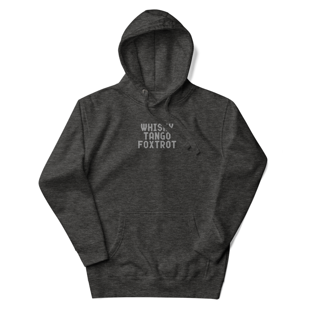 "Whisky Tango Foxtrot (What the f#ck)" printed on a charcoal heather unisex hoodie laying on a flat surface with the hood up