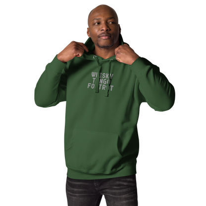 "Whisky Tango Foxtrot (What the f#ck)" printed on a forest green unisex hoodie worn by a male