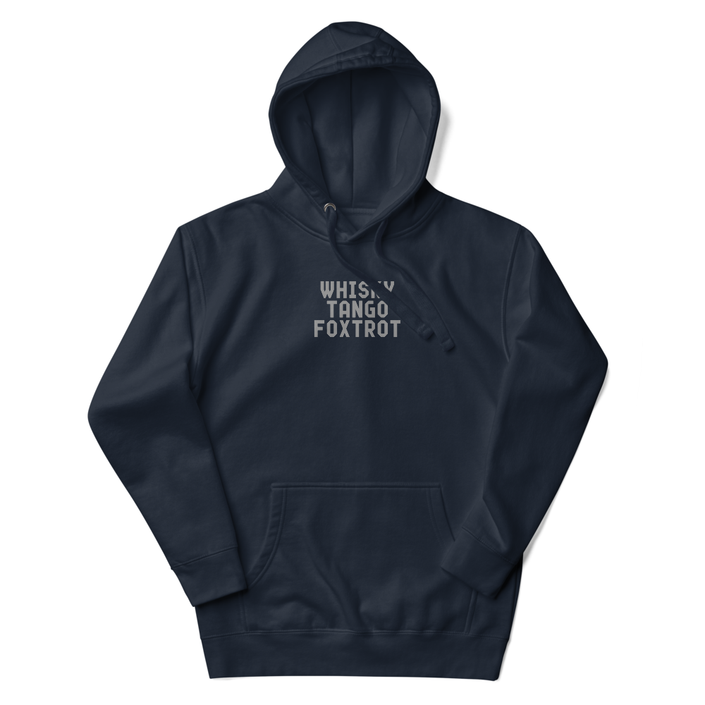 "Whisky Tango Foxtrot (What the f#ck)" printed on a navy blazer unisex hoodie laying on a flat surface with the hood up