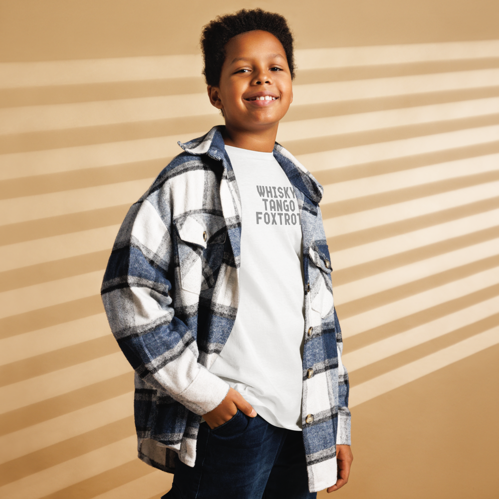 "Whisky Tango Foxtrot (What the f#ck)" printed on a white youth classic tee worn by a male also wearing a jacket