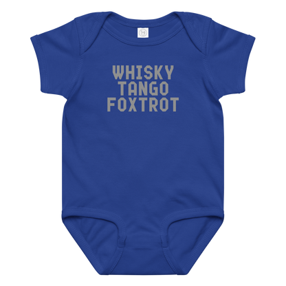 "Whisky Tango Foxtrot (What the f#ck)" printed on a royal baby jersey bodysuit laying on a flat surface amongst other clothes