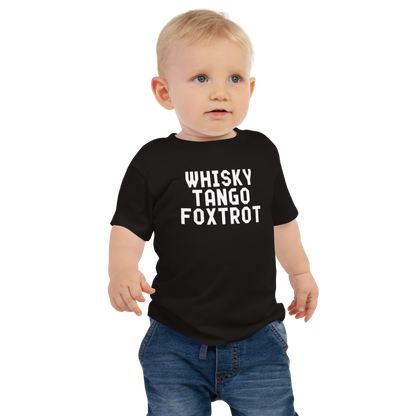 "Whisky Tango Foxtrot (What the f#ck)" printed on a black baby jersey short sleeve tee worn by a male
