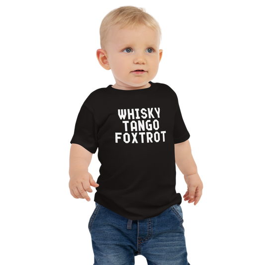 "Whisky Tango Foxtrot (What the f#ck)" printed on a black baby jersey short sleeve tee worn by a male