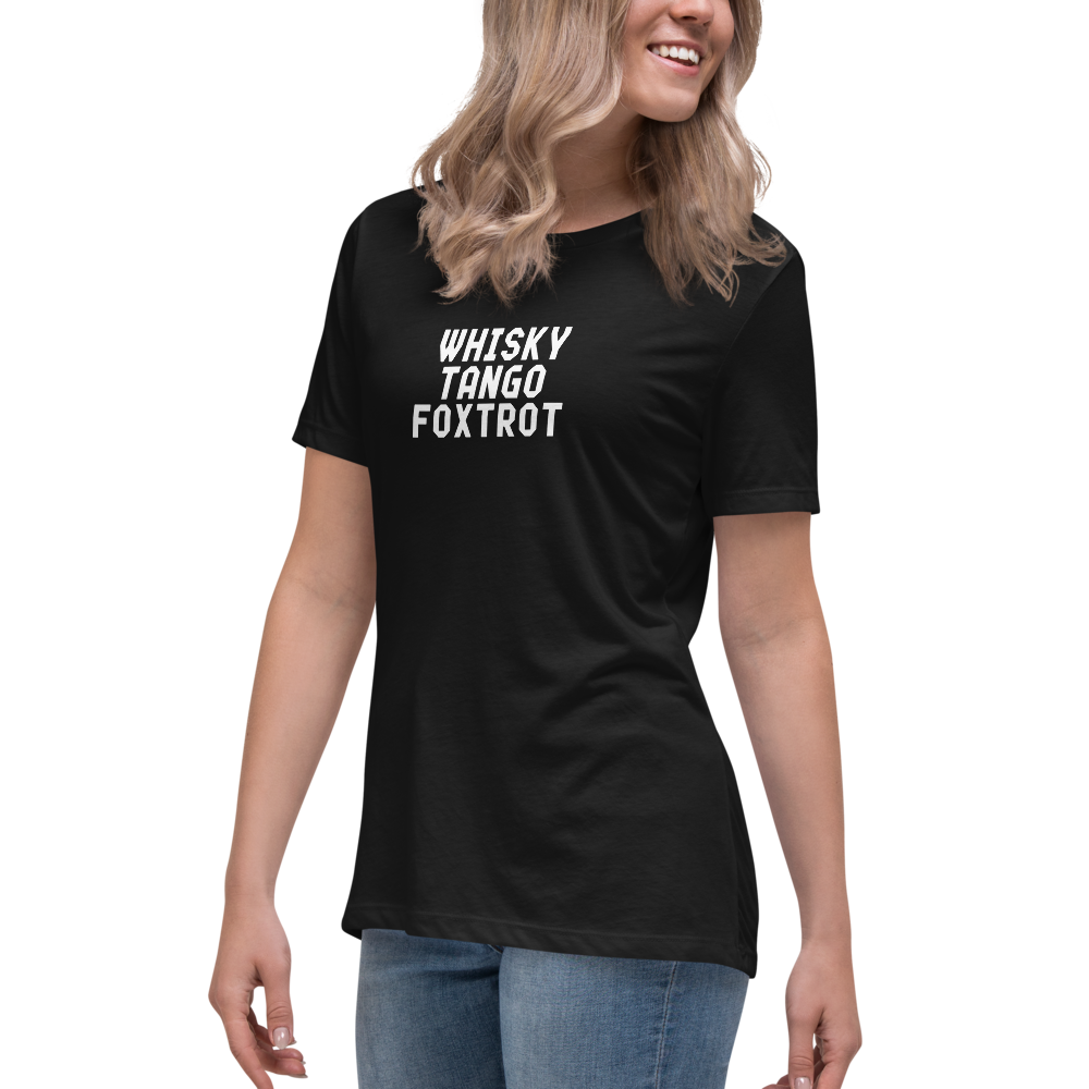 "Whisky Tango Foxtrot (What the f#ck)" printed on a black women's relaxed t-shirt worn by a female