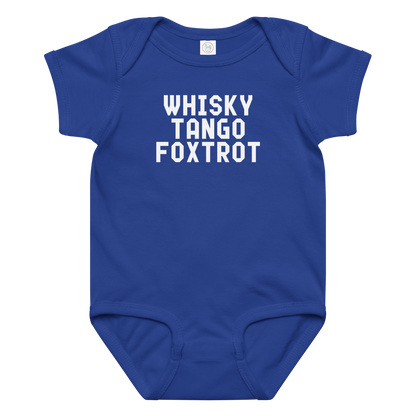 "Whisky Tango Foxtrot (What the f#ck)" printed on a royal baby jersey bodysuit laying on a flat surface amongst other clothes
