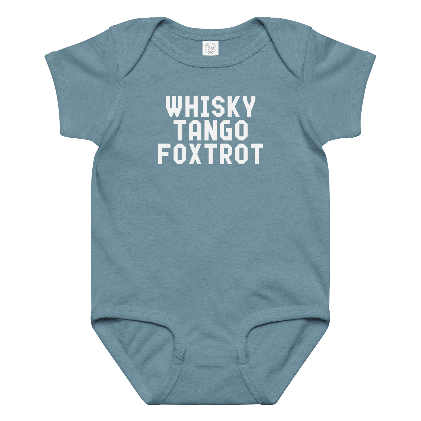 "Whisky Tango Foxtrot (What the f#ck)" printed on a vintage indigo baby jersey bodysuit laying on a flat surface amongst other clothes