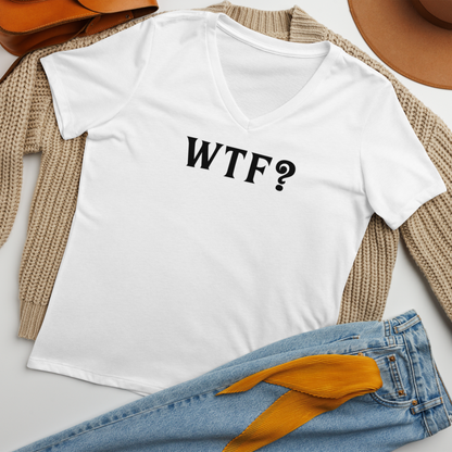 "WTF? (What the f#ck?)" printed on a solid white blend women's relaxed v-neck t-shirt laying on a flat surface amongst other clothes