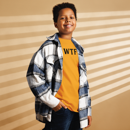 "WTF? (What the f#ck?)" printed on a gold youth classic tee worn by a male also wearing a jacket