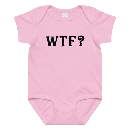 "WTF? (What the f#ck?)" printed on a pink baby jersey bodysuit laying on a flat surface amongst other clothes