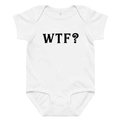 "WTF? (What the f#ck?)" printed on a white baby jersey bodysuit laying on a flat surface amongst other clothes