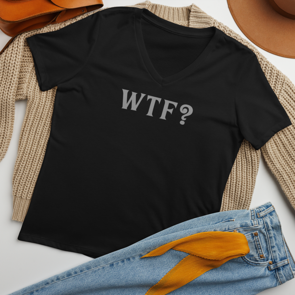 "WTF? (What the f#ck?)" printed on a solid black blend women's relaxed v-neck t-shirt laying on a flat surface amongst other clothes