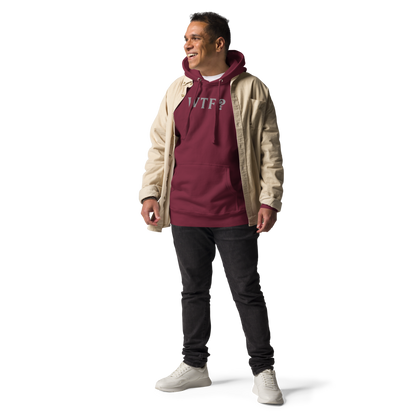 "WTF? (What the f#ck?)" printed on a maroon unisex hoodie worn by a male with a jacket on top