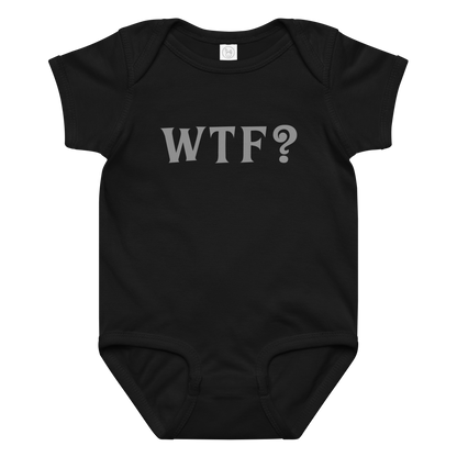 "WTF? (What the f#ck?)" printed on a black baby jersey bodysuit laying on a flat surface amongst other clothes