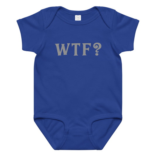 "WTF? (What the f#ck?)" printed on a royal baby jersey bodysuit laying on a flat surface amongst other clothes