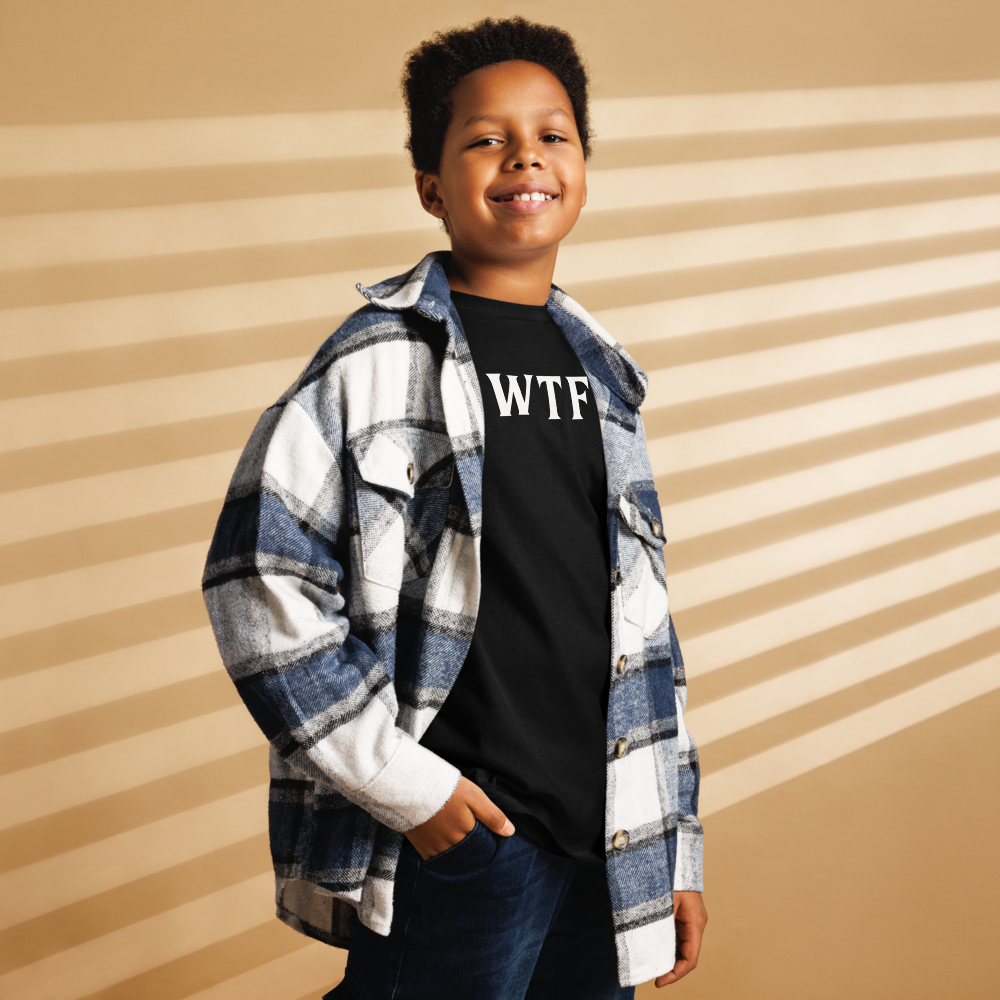 "WTF? (What the f#ck?)" printed on a black youth classic tee worn by a male also wearing a jacket