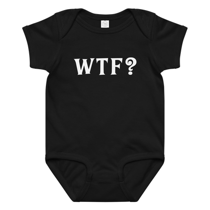 "WTF? (What the f#ck?)" printed on a black baby jersey bodysuit laying on a flat surface amongst other clothes