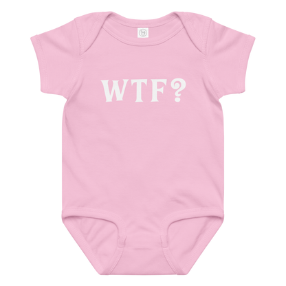 "WTF? (What the f#ck?)" printed on a pink baby jersey bodysuit laying on a flat surface amongst other clothes
