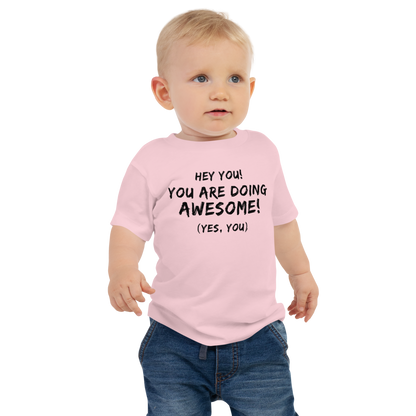 "Hey You! You are doing awesome! (Yes, you)" printed on a pink baby jersey short sleeve tee worn by a male