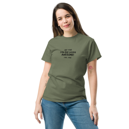 "Hey You! You are doing awesome! (Yes, you)" printed on a military green unisex classic tee worn by a female