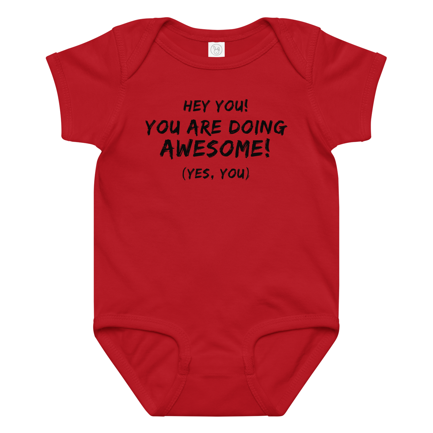 "Hey You! You are doing awesome! (Yes, you)" printed on a red baby jersey bodysuit laying on a flat surface amongst other clothes
