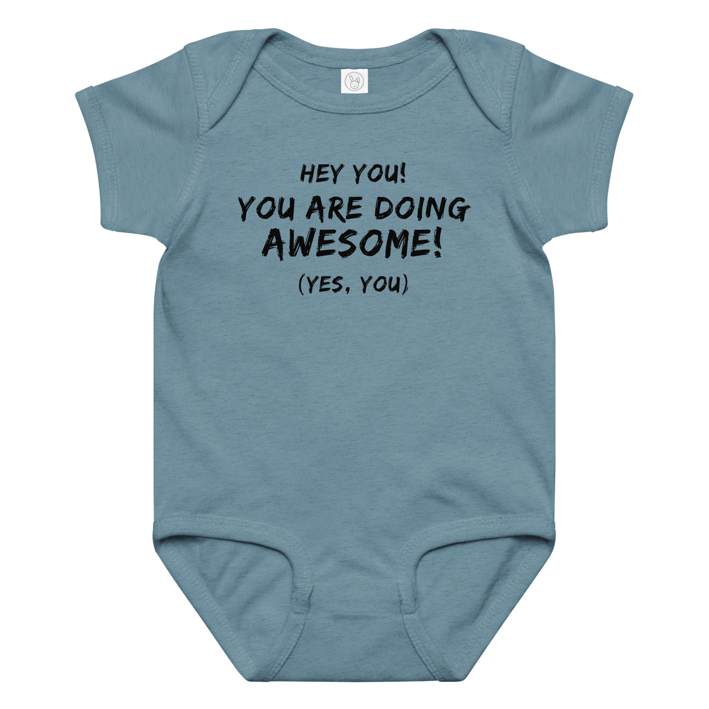 "Hey You! You are doing awesome! (Yes, you)" printed on a vintage indigo baby jersey bodysuit laying on a flat surface amongst other clothes