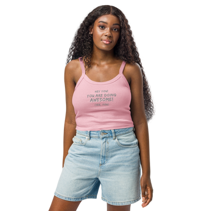 "Hey You! You are doing awesome! (Yes, you)" printed on a solid pink blend women's micro-rib tanktop worn by a female