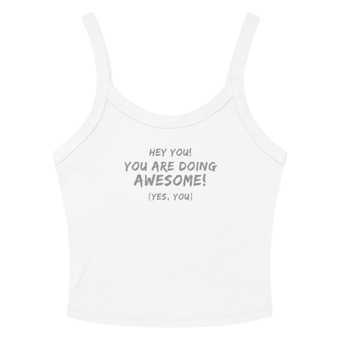 "Hey You! You are doing awesome! (Yes, you)" printed on a solid white blend women's micro-rib tanktop laying on a flat surface amongst sunglasses and shorts
