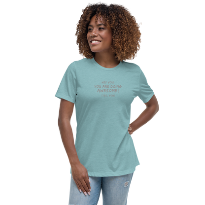 "Hey You! You are doing awesome! (Yes, you)" printed on a heather blue lagoon women's relaxed t-shirt worn by a female