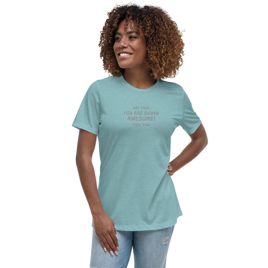 "Hey You! You are doing awesome! (Yes, you)" printed on a heather blue lagoon women's relaxed t-shirt worn by a female