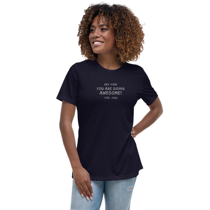 "Hey You! You are doing awesome! (Yes, you)" printed on a navy women's relaxed t-shirt worn by a female