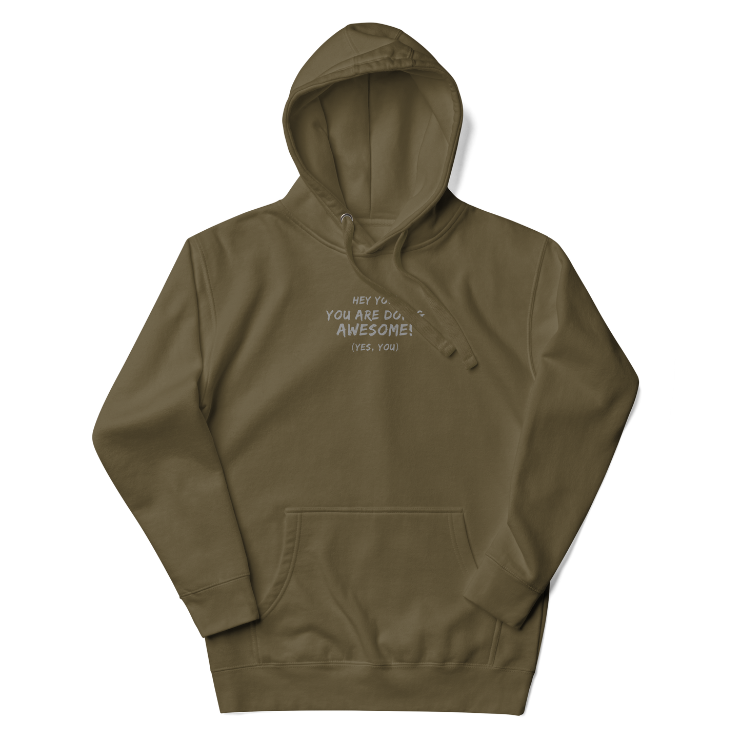 "Hey You! You are doing awesome! (Yes, you)" printed on a military green unisex hoodie laying on a flat surface with the hood up