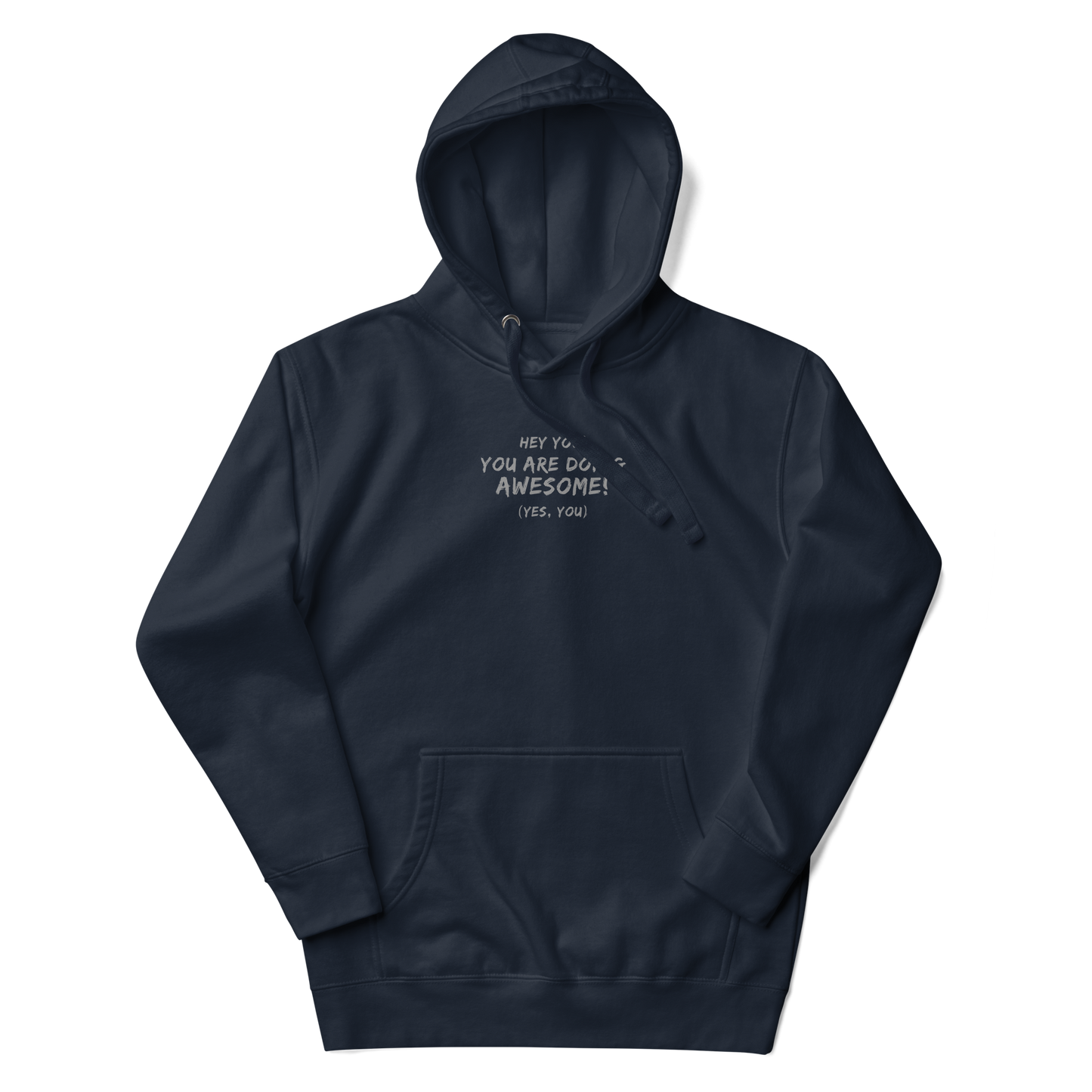 "Hey You! You are doing awesome! (Yes, you)" printed on a navy blazer unisex hoodie laying on a flat surface with the hood up